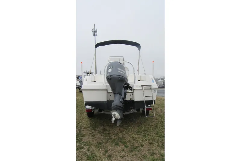 Slide: The Image of 2015 Robalo R180 Center Console boat with Yamaha outboard motor, rear view. - 6
