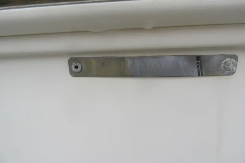 Slide: The Image of 2015 Robalo R180 Center Console boat identification plate on white surface. - 7