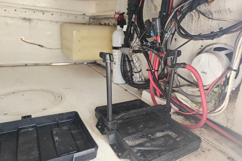 Slide: The Image of Interior of a 1996 Mako 231 Center Console boat showing wiring and battery compartment. - 40