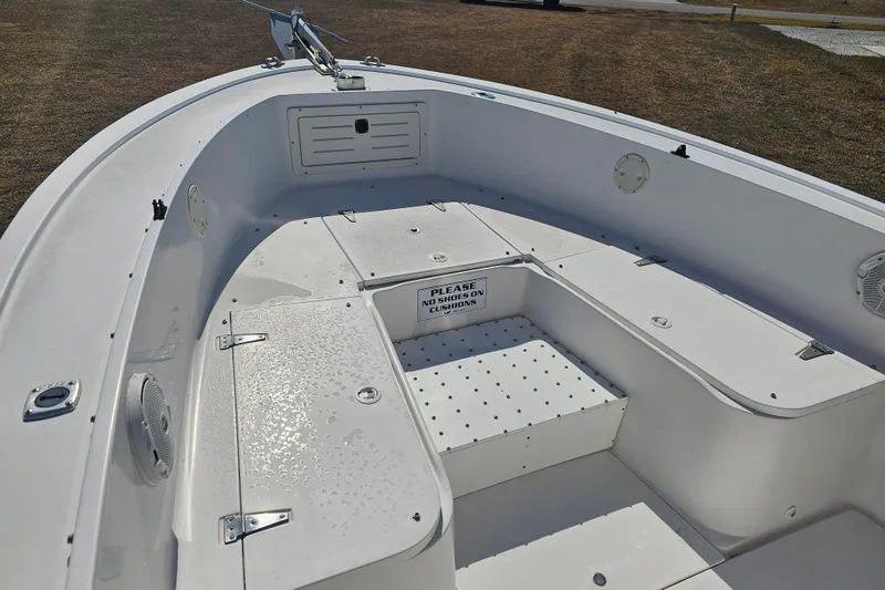 Slide: The Image of 1996 Mako 231 Center Console boat interior with seating and storage compartments. - 42
