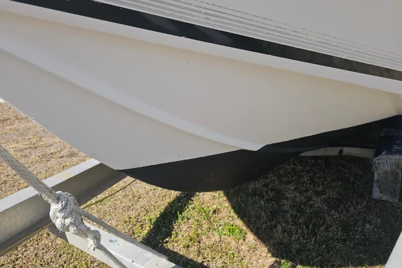Slide: The Image of Close-up of 1996 Mako 231 Center Console boat hull on trailer. - 45