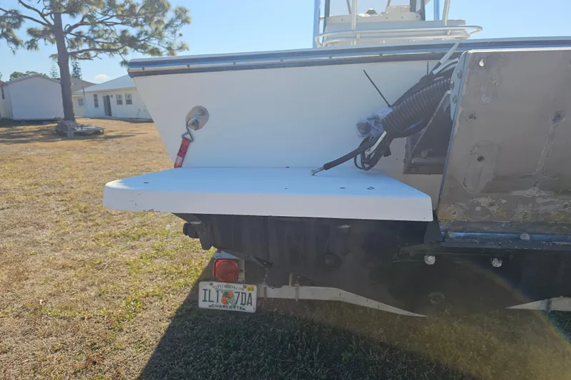 Slide: The Image of 1996 Mako 231 Center Console boat rear view with Florida license plate. - 47