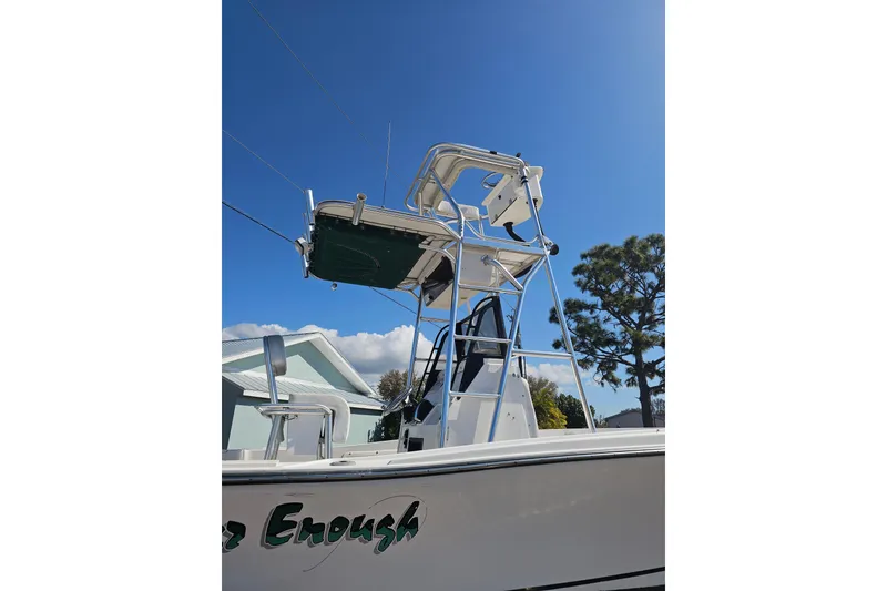 Slide: The Image of 1996 Mako 231 Center Console boat with tower against clear blue sky. - 9