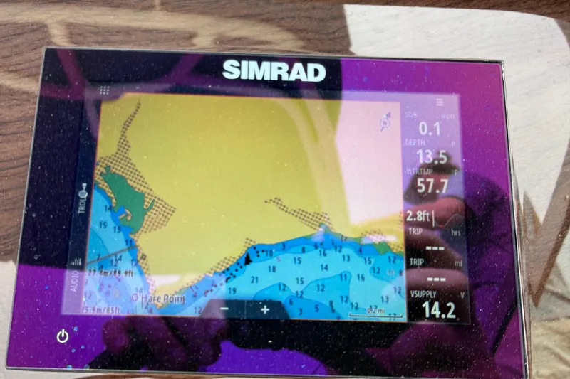 Slide: The Image of Simrad navigation display on 2024 Chaparral 21 SSi OB boat, showing depth and water temperature. - 10