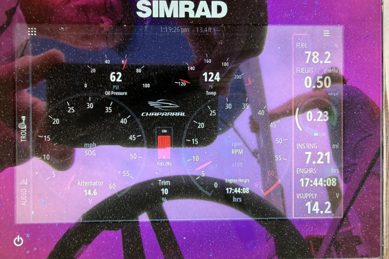 Slide: The Image of 2024 Chaparral 21 SSi OB dashboard display with Simrad navigation system. - 11