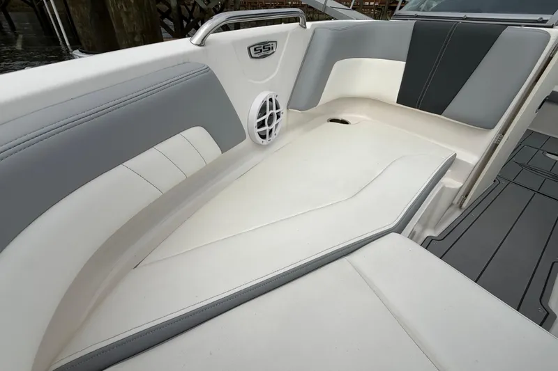 Slide: The Image of 2024 Chaparral 21 SSi OB boat interior with gray and white seating. - 20