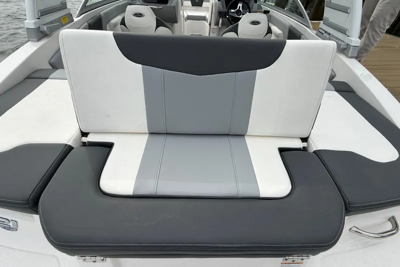 Slide: The Image of 2024 Chaparral 21 SSi OB boat interior with gray and white seating. - 24