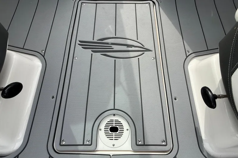 Slide: The Image of 2024 Chaparral 21 SSi OB boat deck with logo and sleek design. - 28