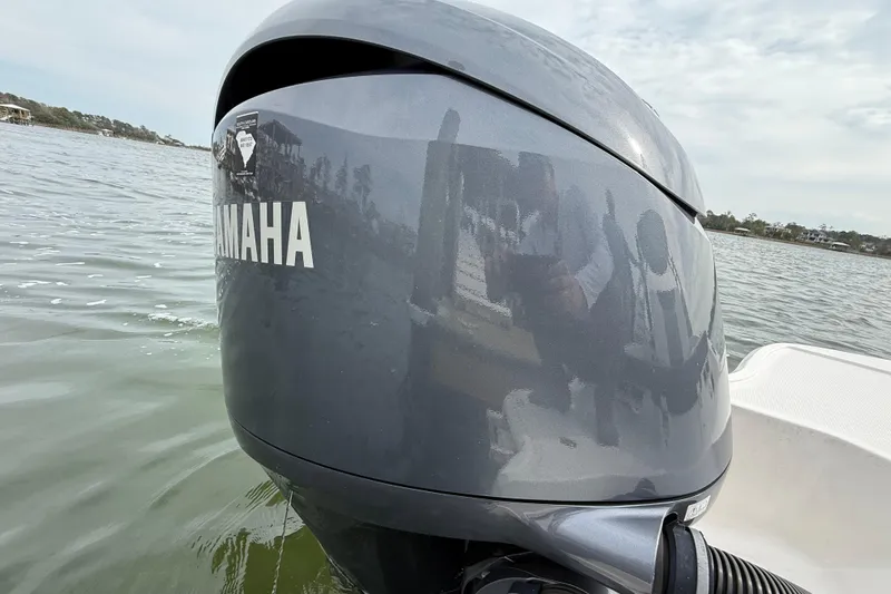 Slide: The Image of 2024 Chaparral 21 SSi OB with Yamaha outboard motor on water. - 8