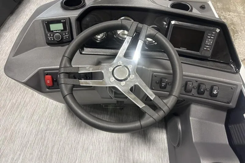 Slide: The Image of Steering console of 2026 Bennington 22 SSRSF boat with modern controls and displays. - 12