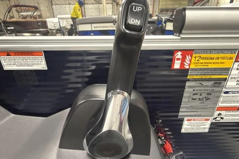 Slide: The Image of Throttle control lever on a 2026 Bennington 22 SSRSF boat, with capacity warnings. - 13
