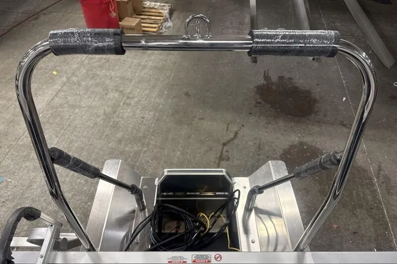 Slide: The Image of 2026 Bennington 22 SSRSF boat ladder with chrome finish and protective padding. - 16