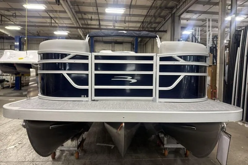 Slide: The Image of 2026 Bennington 22 SSRSF pontoon boat in a warehouse setting. - 3