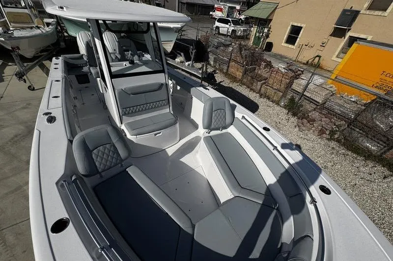 Slide: The Image of 2026 Sportsman Heritage 261 Center Console boat with spacious seating and modern design. - 10