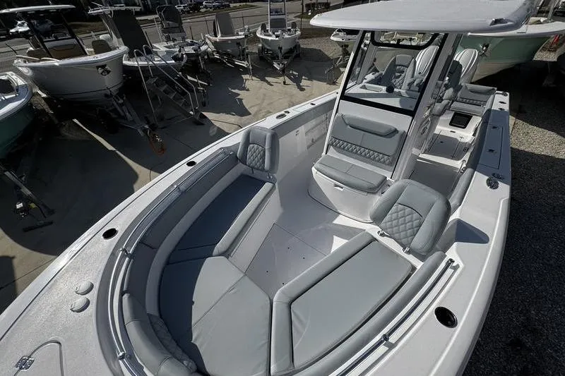 Slide: The Image of 2026 Sportsman Heritage 261 Center Console boat with spacious seating and modern design. - 11