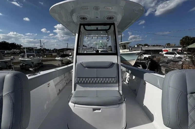 Slide: The Image of 2026 Sportsman Heritage 261 Center Console boat interior with seating and console view. - 13