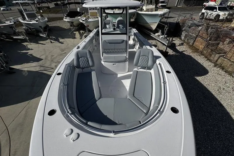 Slide: The Image of 2026 Sportsman Heritage 261 Center Console boat with spacious seating and modern design. - 14