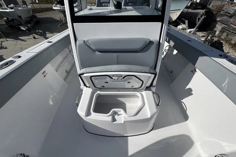 Slide: The Image of 2026 Sportsman Heritage 261 Center Console boat interior with open storage compartment. - 15