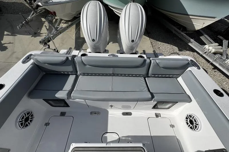 Slide: The Image of 2026 Sportsman Heritage 261 Center Console boat with dual engines and spacious seating. - 29