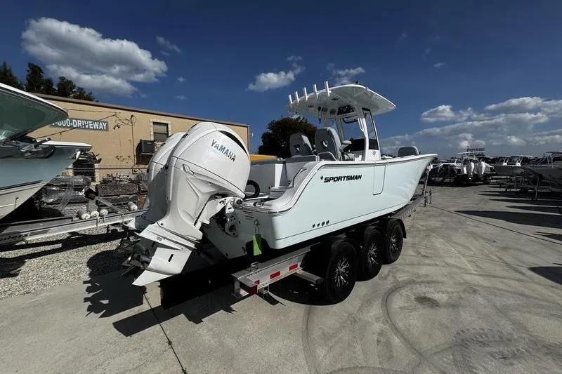 Slide: The Image of 2026 Sportsman Heritage 261 Center Console boat on trailer, featuring Yamaha engine. - 3