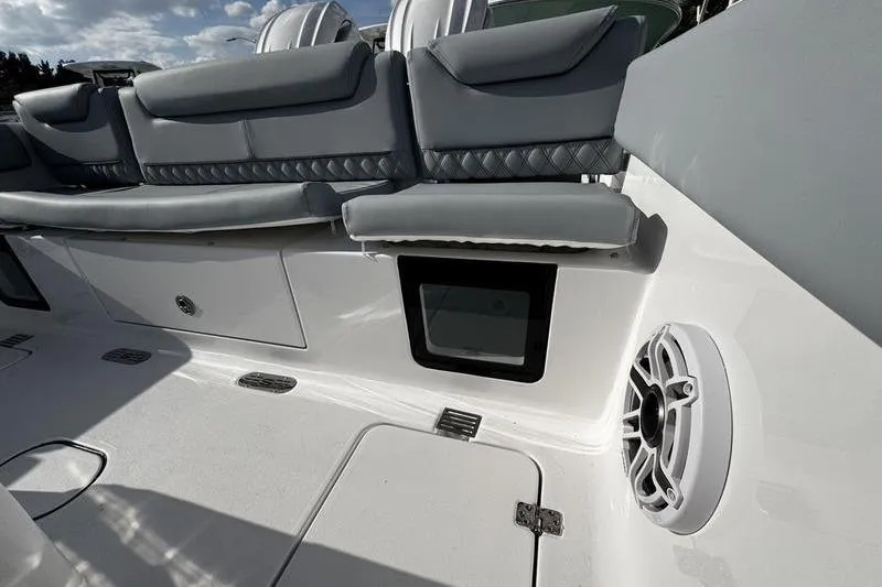 Slide: The Image of 2026 Sportsman Heritage 261 Center Console interior with gray seating and speaker detail. - 31