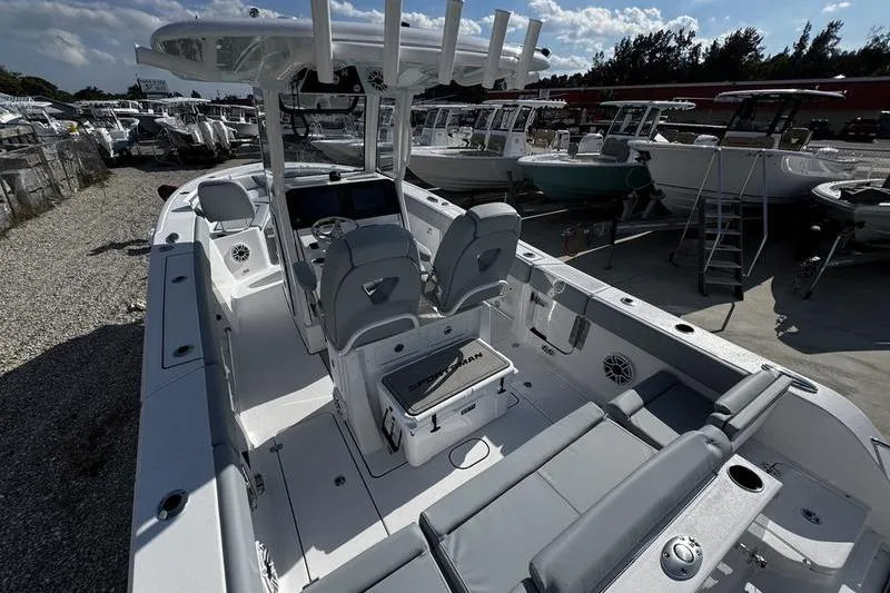 Slide: The Image of 2026 Sportsman Heritage 261 Center Console boat with sleek design and spacious seating. - 34
