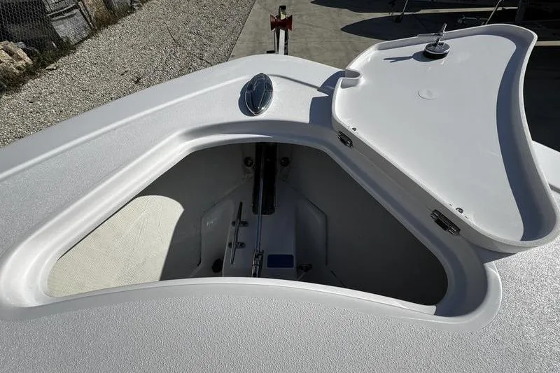 Slide: The Image of 2026 Sportsman Heritage 261 Center Console anchor locker with open hatch. - 4