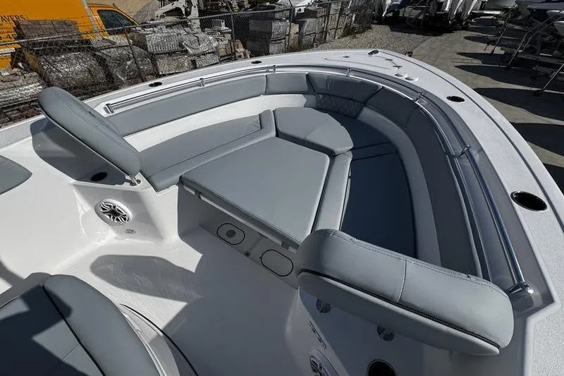 Slide: The Image of 2026 Sportsman Heritage 261 Center Console boat with spacious seating and modern design. - 7