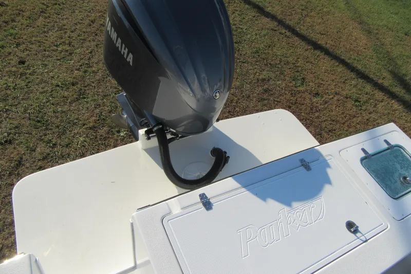 Slide: The Image of 2024 Parker 2320 SL Sport Cabin boat with Yamaha engine, rear deck view. - 10