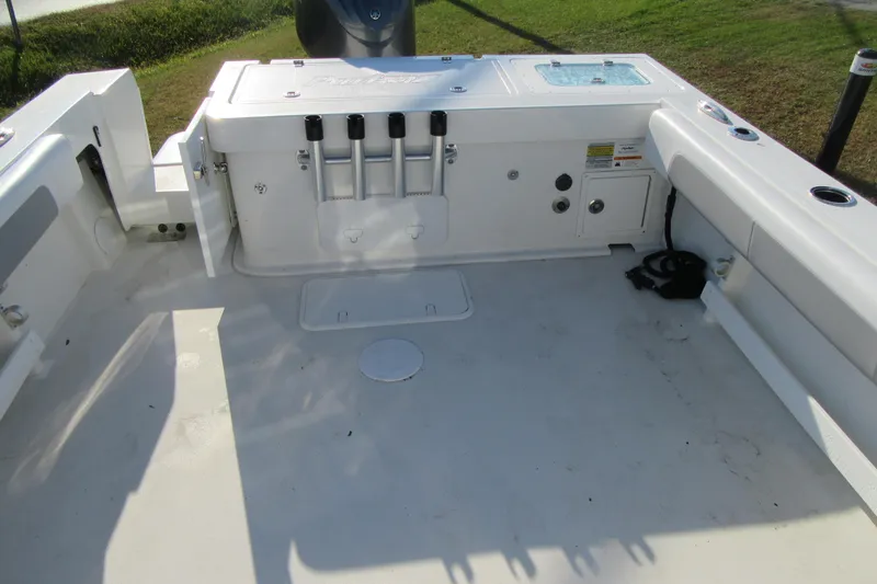 Slide: The Image of 2024 Parker 2320 SL Sport Cabin boat deck with storage and rod holders. - 14