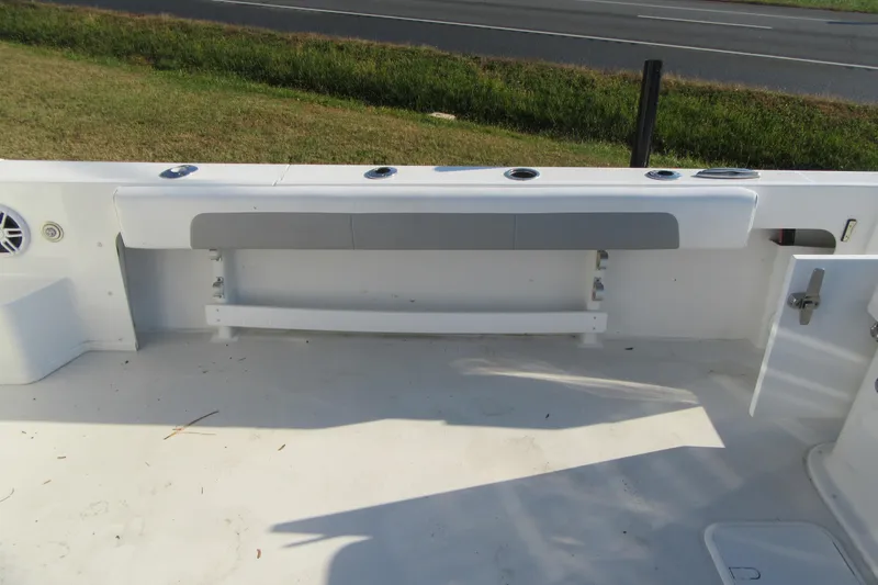 Slide: The Image of 2024 Parker 2320 SL Sport Cabin boat interior with seating and storage. - 15