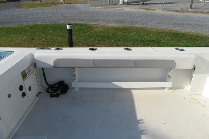 Slide: The Image of 2024 Parker 2320 SL Sport Cabin boat interior with seating and rod holders. - 16