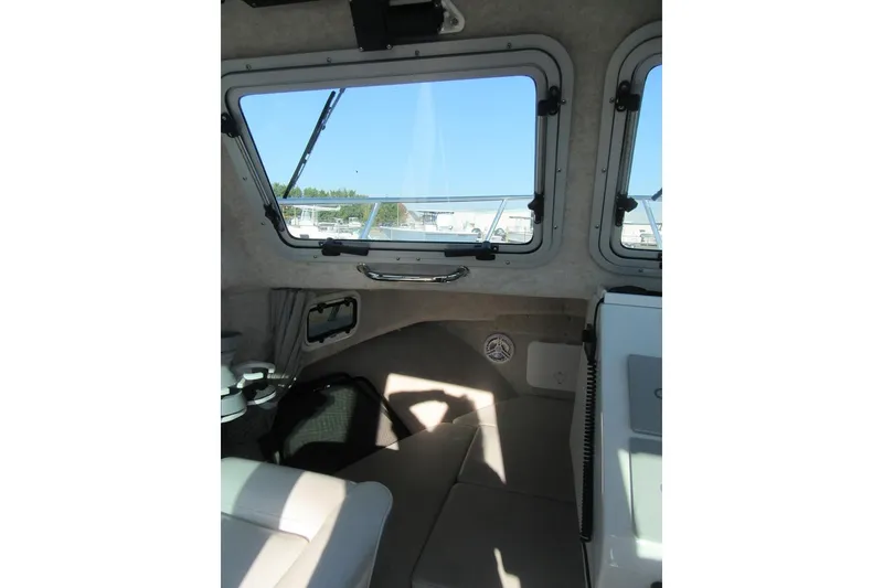 Slide: The Image of 2024 Parker 2320 SL Sport Cabin interior with windows and seating. - 22