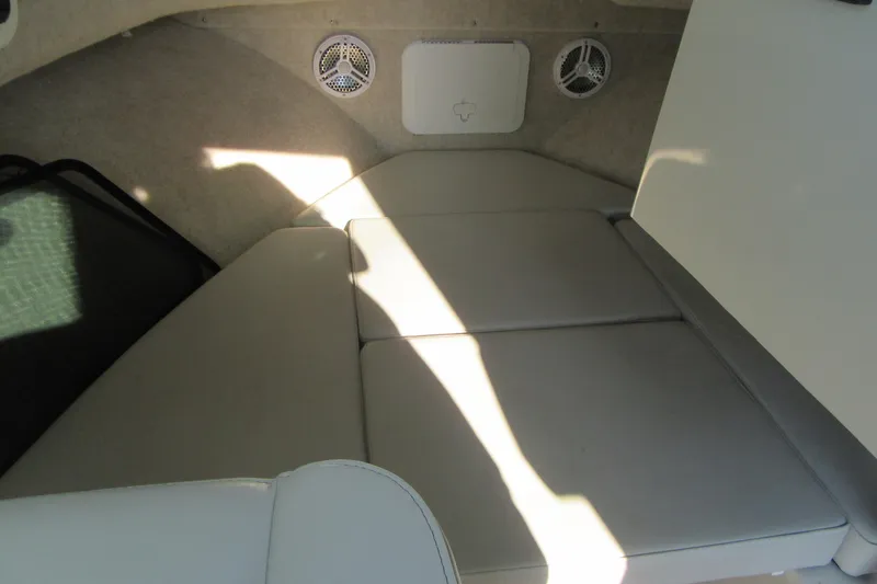 Slide: The Image of 2024 Parker 2320 SL Sport Cabin interior with cushioned seating and built-in speakers. - 25