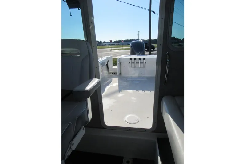 Slide: The Image of 2024 Parker 2320 SL Sport Cabin interior view, showcasing seating and deck area. - 30