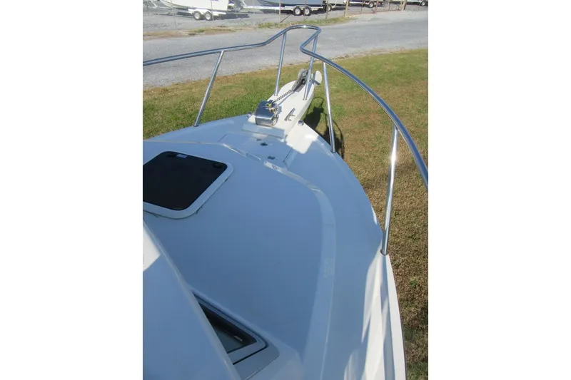 Slide: The Image of 2024 Parker 2320 SL Sport Cabin boat deck with railing and hatch. - 34
