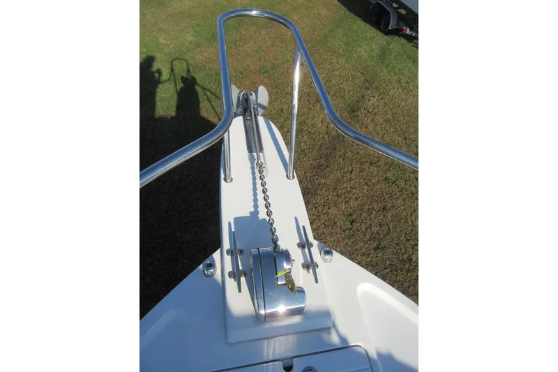 Slide: The Image of 2024 Parker 2320 SL Sport Cabin boat anchor system on grassy background. - 35