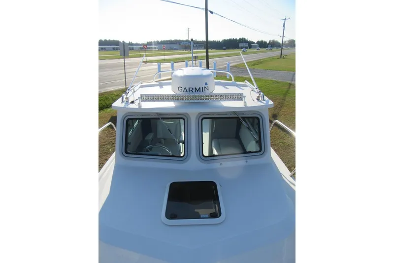 Slide: The Image of 2024 Parker 2320 SL Sport Cabin boat with Garmin radar on top. - 36