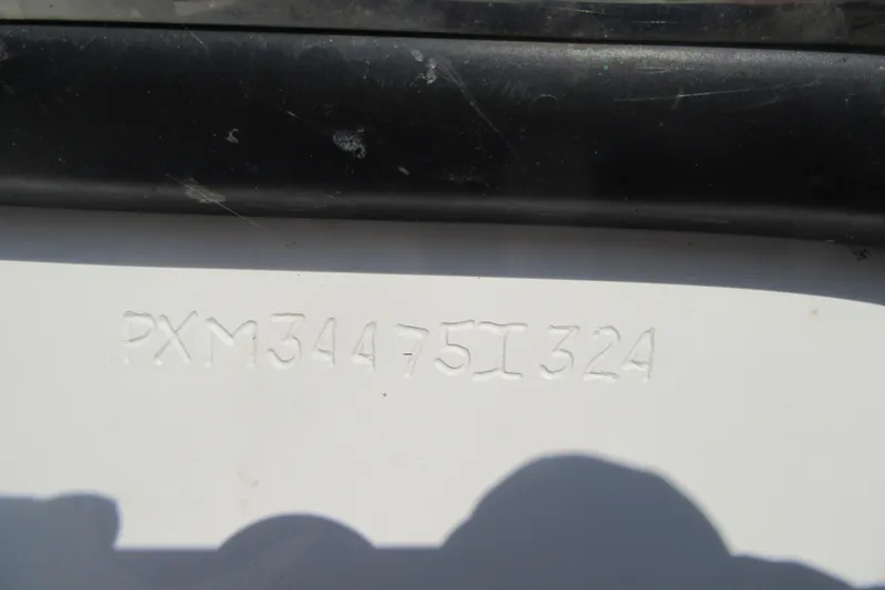 Slide: The Image of 2024 Parker 2320 SL Sport Cabin hull identification number (HIN) engraved on the boat. - 9