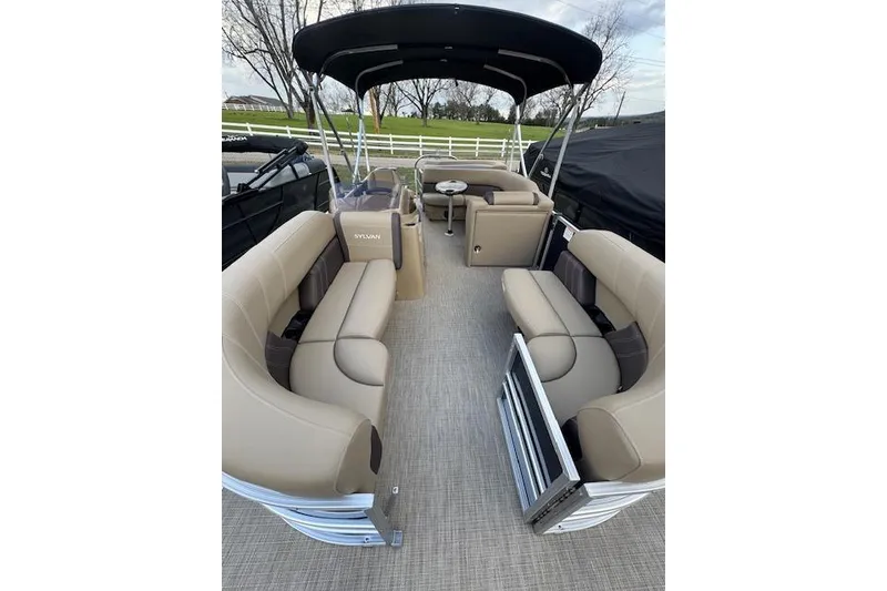 Slide: The Image of 2026 Sylvan Mirage 820 CRS pontoon boat with spacious seating and canopy. - 11