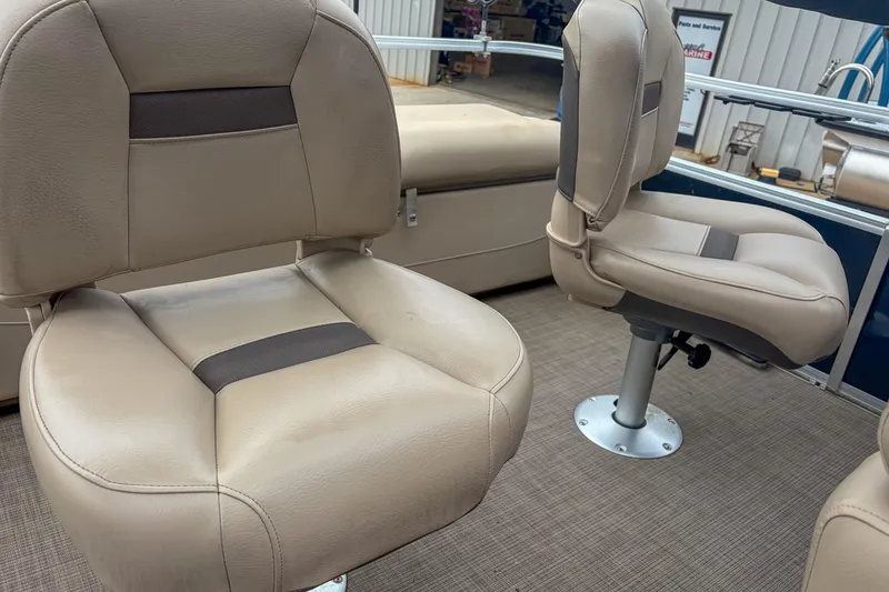 Slide: The Image of 2022 Sun Tracker Fishin' Barge 22 DLX beige seats on carpeted deck. - 14