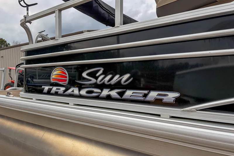 Slide: The Image of 2022 Sun Tracker Fishin' Barge 22 DLX pontoon boat with logo detail. - 5