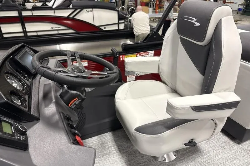 Slide: The Image of 2026 Bennington 22 SSRSF boat interior with steering wheel and captain's chair. - 15