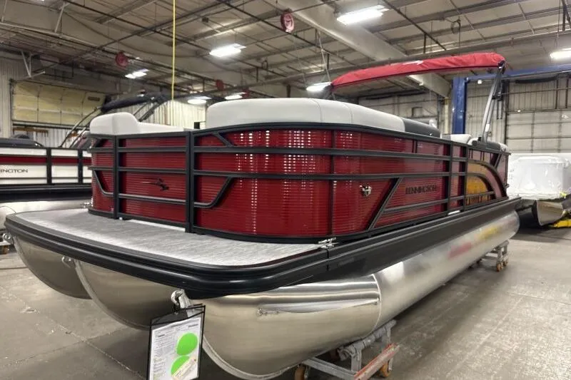 Slide: The Image of 2026 Bennington 22 SSRSF pontoon boat in a warehouse setting. - 6