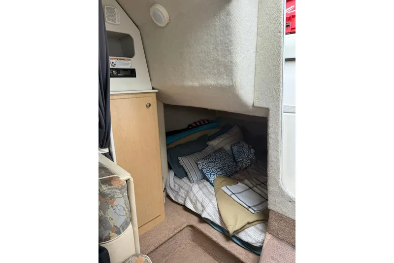 Slide: The Image of Interior cabin of 2000 Bayliner 3055 Ciera Sunbridge with cozy bedding and storage. - 15