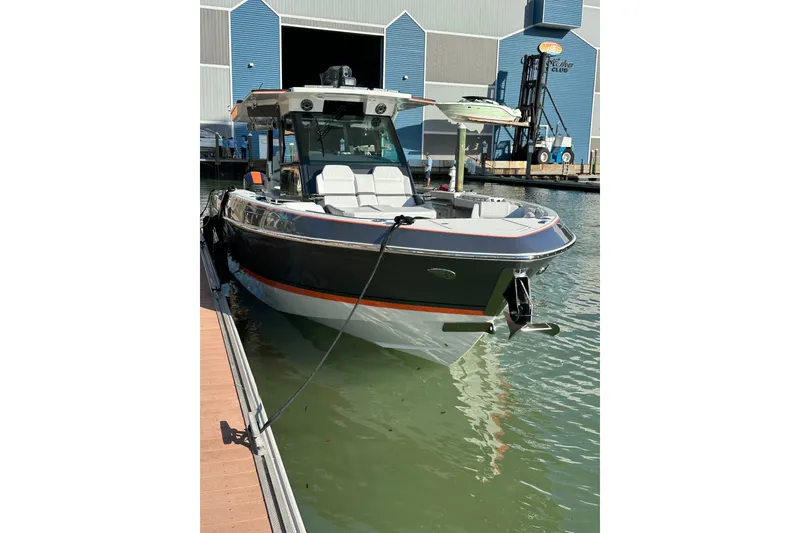 Slide: The Image of 2024 Formula 387 Center Console Fish boat docked at marina. - 12