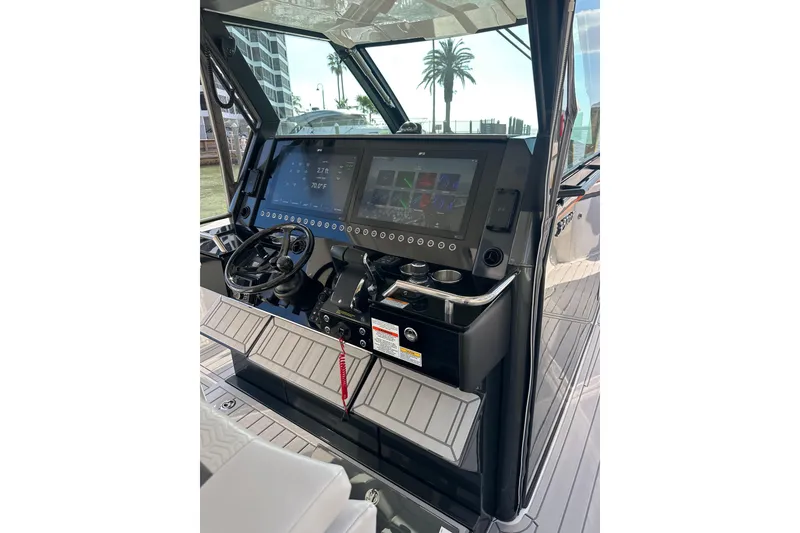 Slide: The Image of 2024 Formula 387 Center Console Fish dashboard with advanced navigation screens and controls. - 16