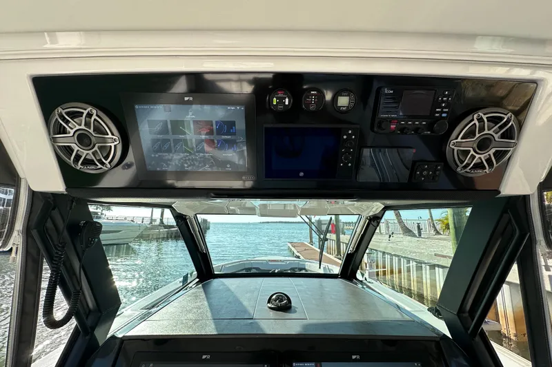 Slide: The Image of 2024 Formula 387 Center Console Fish dashboard with advanced navigation and audio systems. - 18