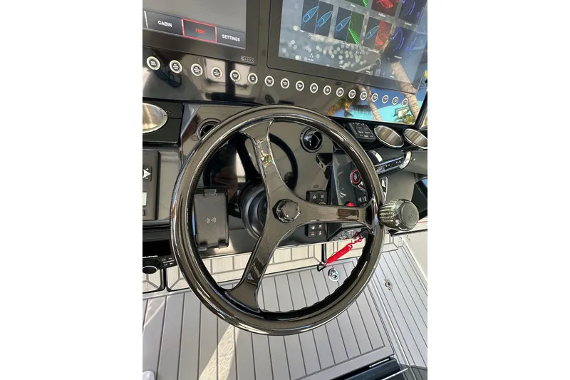 Slide: The Image of Steering wheel and dashboard of 2024 Formula 387 Center Console Fish boat. - 20