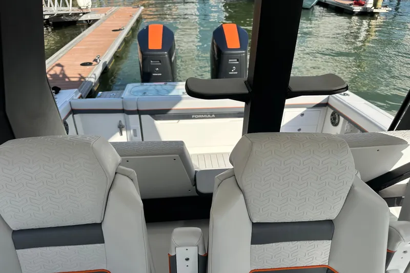 Slide: The Image of 2024 Formula 387 Center Console Fish boat interior with dual outboard motors. - 24